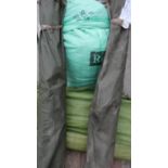 Selection of military style canvas tenting, two bags of tent/camo net poles, and three bags of
