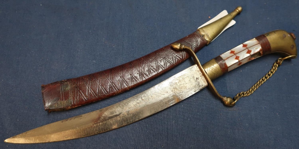 Early 20th C Eastern style dagger with 8 inch slightly curved blade with engraved detail, with brass