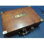 Quality leather and oak lined vintage cartridge case with brass mounts and plaque F.F.M, with six