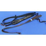 Group of 3 rifle slings including one rubberised, one synthetic and one leather