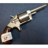 Invincible No.2 .32 rimfire revolver with nickle plated finish, 2 1/2 inch barrel and two piece