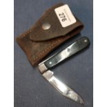 I.XK George Wostenholm of Sheffield single bladed pocket knife with two piece grips and leather belt