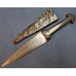 African double edged 5 1/2 inch bladed knife with crude XX decoration with riveted 2 piece horn
