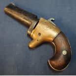 American .41 rimfire Derringer with 2 1/4 inch swivel barrel and two piece wooden grips, serial