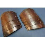 Pair of late 16th C Italian Tassets (upper leg armour) each of four graduated brown patinated