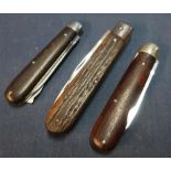 Three vintage pocket knives, one with lambs foots grips, the other with wooden grips, two with