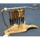 Shop style display stand formed from a piece of fallow deer antler, containing a selection of ten