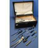 Vintage travelling case containing a quantity of various shooting items and accessories, including