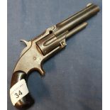 Smith and Wesson .32 rimfire revolver with 3 1/2 inch barrel with engraved details to the top rib