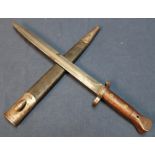 Wilkinson of London double edged bayonet with 12 inch blade and two piece wooden grips, the blade