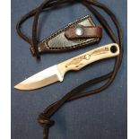 Bear 2 1/4 inch blade sheath knife with 2 piece sambar horn grips and 12 gauge leather leg sheath