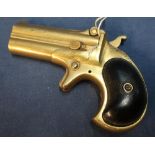 Gold plated Remington .41 rimfire over & under Derringer, the barrel top rib marked Remington Co.