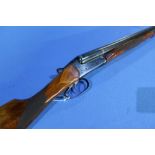 Baikal 12 bore side by side shotgun with 27 3/4 inch barrels and 14 inch straight through stock,