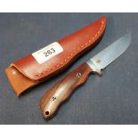 3 inch bladed sheath knife with two piece wooden grips and tan leather belt sheath
