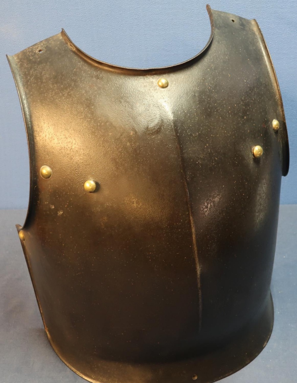 Heavy steel breastplate with brass rivets and mounts, and internal hanging hooks (height 37.5cm)