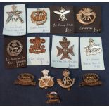 Selection of British military cap badges, mostly Infantry, including Gurkha's, York and Lancaster,