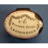 18th/19th C enamel oval patch box with internal mirror, the top marked 'A Present From