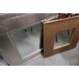 Two modern bevelled edge wall mirrors in silver and gilt finished frames (2)