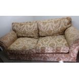 Extremely large two seat sofa in golden pattern fabric with feather filled cushions (width 215cm)