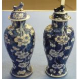 Pair of similar Chinese blue & white blossom pattern vases with four digit signature panel to the
