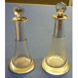 Two similar silver hallmarked collared dressing table glass bottles of tapering bell shaped form,