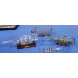 Collection of four ship in bottle figures