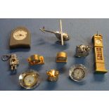 Collection of various novelty clocks in the form of grandfather clock, alarm clock, robot,