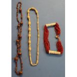 Early - mid 20th C ethnic type bead necklace, another similar made from various nuts, and a