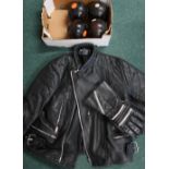 Leather motorbike jacket (size 46) and gauntlet style gloves, and a set of four bowling boules