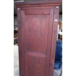 Early 20th C stained vestry cupboard enclosed by single panelled door, with internal Communion
