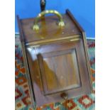 Edwardian mahogany slope front coal box with brass handle and coal shovel and panelled detail to the
