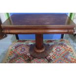 19th C mahogany fold over tea table on octagonal column and circular base (width 92cm)