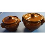Two brown glazed twin handled crock pots (height 21cm and 18cm)