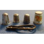 Three silver hallmarked thimbles, a folding button hook and a Royal Worcester thimble (5)