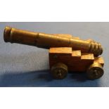 Brass model of a cannon with 15cm staged barrel on oak carriage