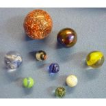 Tray containing a large selection of various assorted and various sized marbles