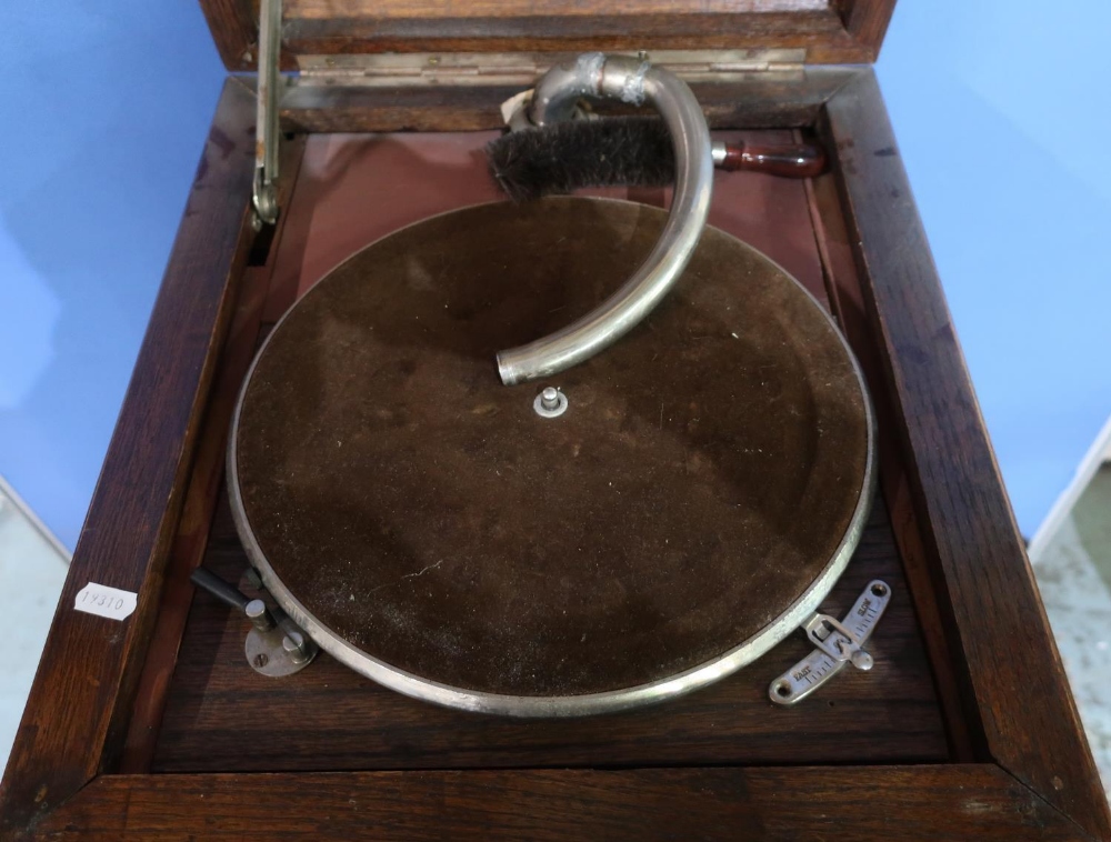 Early 20th C oak cased gramophone with hinged top and four cupboard doors, with various records - Image 2 of 3