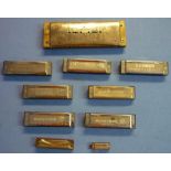 Selection of various harmonicas including Hohner International, Hohner Up To Date signed