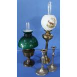 Two 20th C oil lamps and a pair of 19th C silver plated candlesticks (A/F)