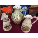 Three Yorkshire Moorlands Pottery jugs of various design and pattern, two with decoration of