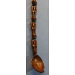 Unusual 19th C native tribal carved wooden spoon, the stem in the form of three male figures (