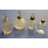 Three cut glass scent bottles with silver hallmarked collars and anther (4)