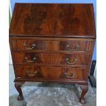Mahogany bureau with fall front above three drawers, on ball & claw feet (width 76cm)