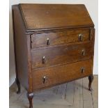 20th C oak bureau with fall front above three drawers (width 79cm)