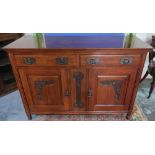 Art Nouveau mahogany sideboard with two drawers above two panelled cupboard doors, with hammered