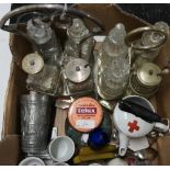 Box containing a selection of various items including two silver plated cruet sets, vintage tins,
