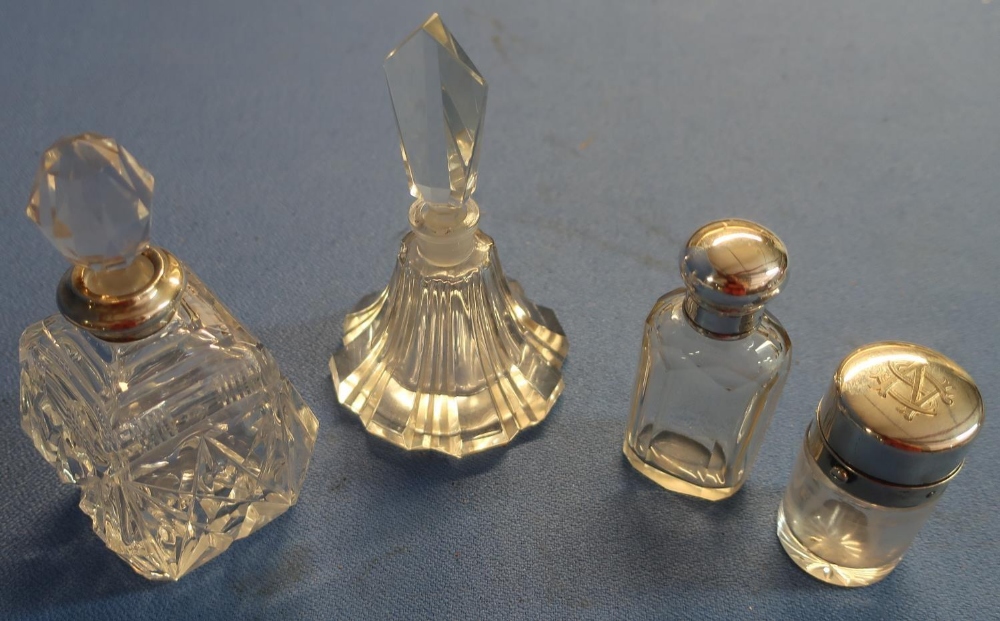 Three silver hallmarked topped glass scent bottles and another glass scent bottle (4)