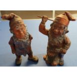 Two 19th/20th C Austrian style painted terracotta garden gnomes, one as an axe-man, the other wearin