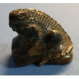 Carved tigers eye stone figure of a lizard upon rock (6cm high) and another carved crystal rock of a