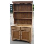 Pine dresser with two tier raised back above two drawers and two panelled cupboard doors (99cm x